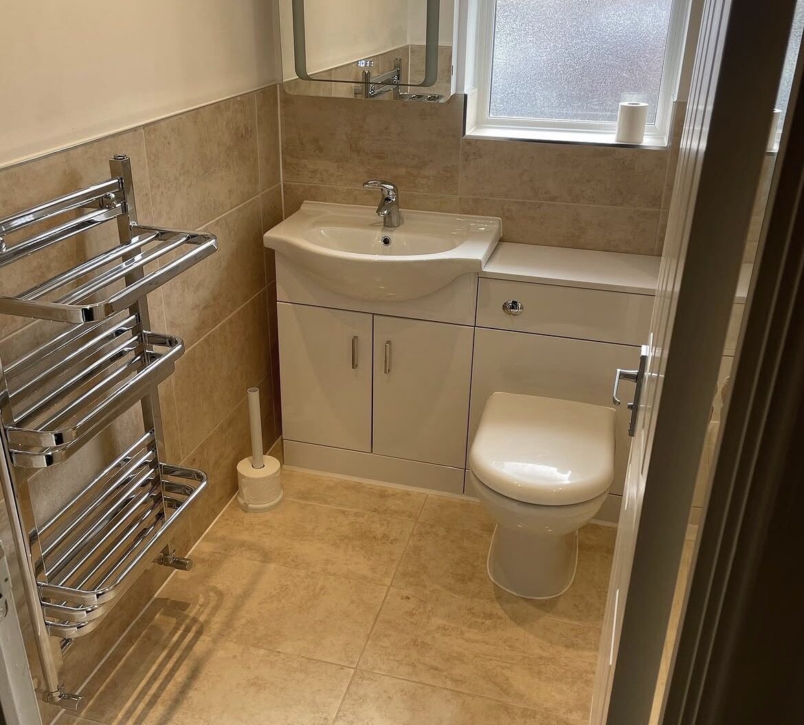 Bathroom installation with towel rail